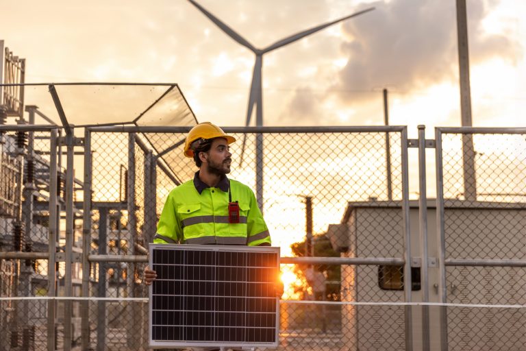 Professional Man Energy Engineer Holding the Solar Panel